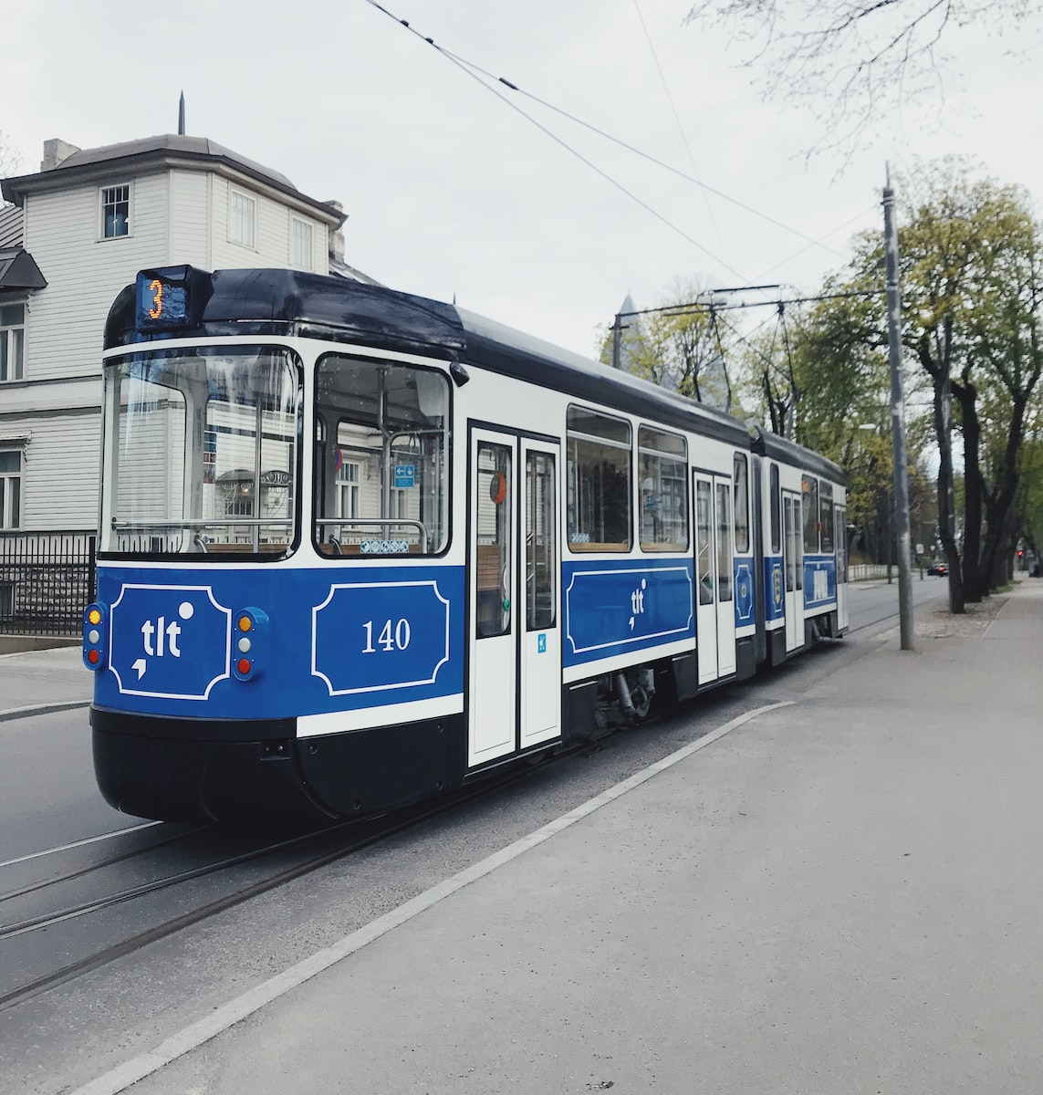 white and blue train on rail road during daytime best christmas